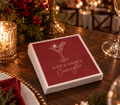 Holiday cocktail wedding napkins with candy cane drink illustration and custom couple names for winter celebrations.