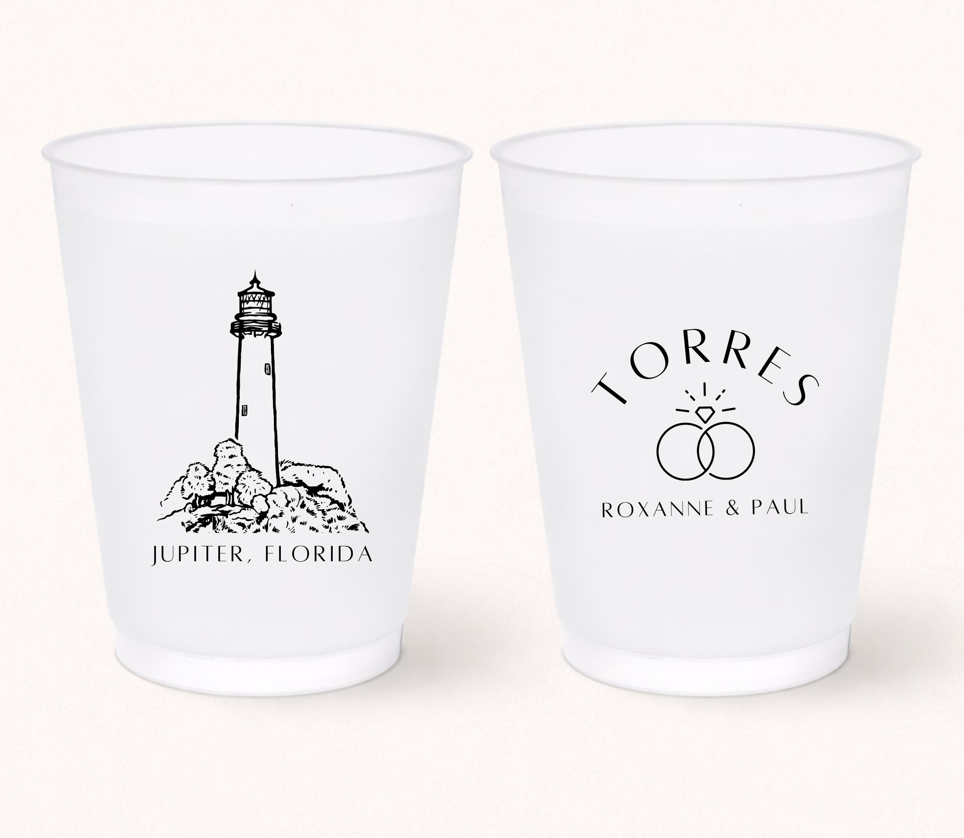 Personalized frosted wedding cups featuring a lighthouse illustration, wedding ring design, and custom couple names