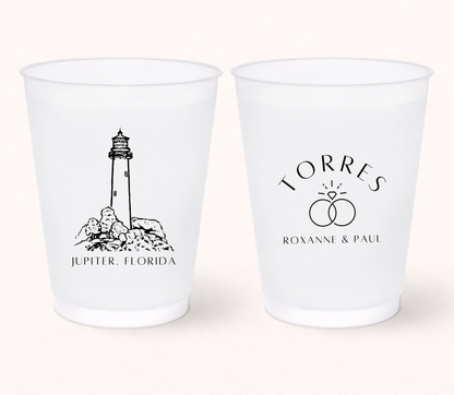 Personalized frosted wedding cups featuring a lighthouse illustration, wedding ring design, and custom couple names
