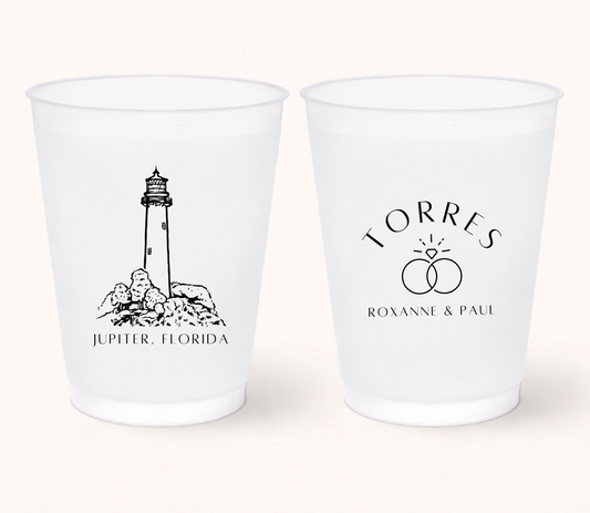 Personalized frosted wedding cups featuring a lighthouse illustration, wedding ring design, and custom couple names