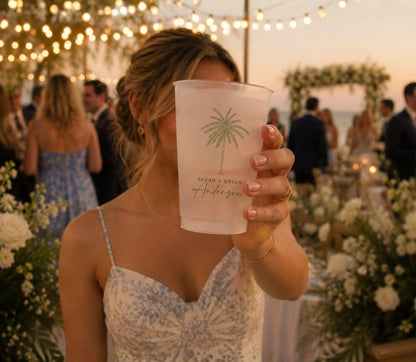 Custom coastal wedding drink cup featuring elegant palm tree artwork and wedding personalization.
Beach wedding frosted plastic cup with custom family name, wedding date, and tropical design.
Destination wedding drinkware featuring a palm tree illustration and personalized Palm Beach wedding details.