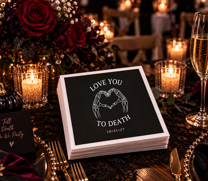 Personalized black skeleton wedding napkin featuring Love You to Death lettering and heart-shaped skeleton hands.