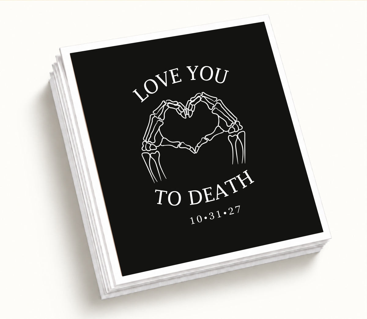 Personalized black Love You to Death wedding napkin featuring white skeleton hands forming a heart and custom Halloween wedding date 10.31.27.