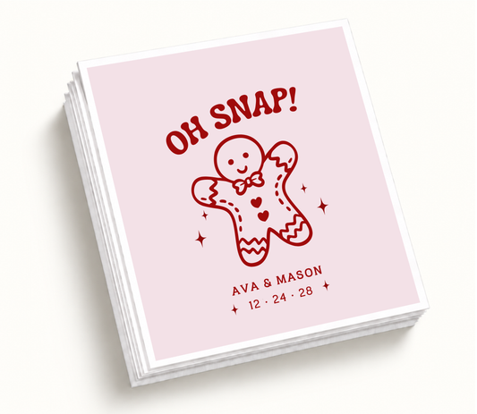 Personalized Oh Snap gingerbread Christmas wedding napkins featuring blush pink background, red gingerbread illustration, custom couple names, and wedding date.