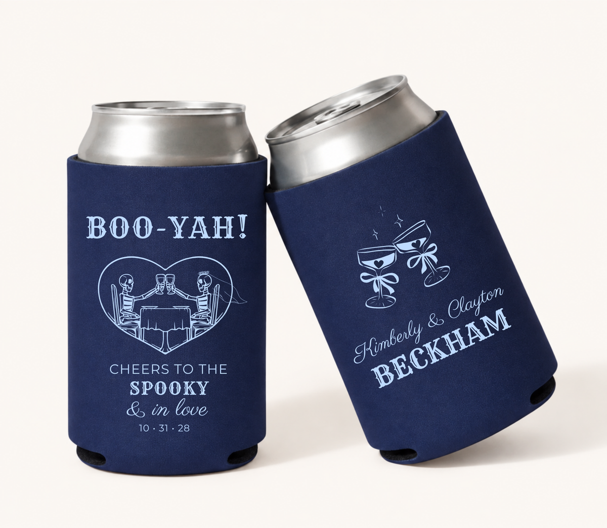 Personalized Boo-Yah Spooky in Love navy Halloween wedding can coolers featuring skeleton couple artwork, custom names, family name, wedding date, and champagne glass design.