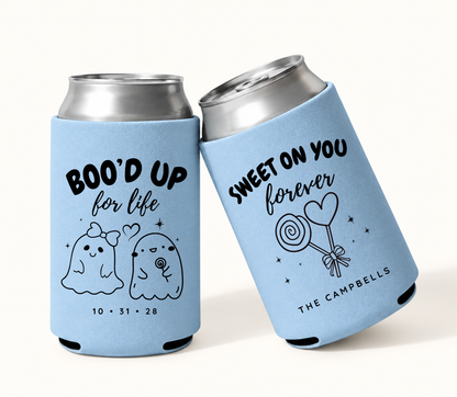 Personalized Boo’d Up for Life light blue Halloween wedding can coolers featuring a cute ghost couple, custom wedding date, family surname, and Sweet on You Forever candy design.