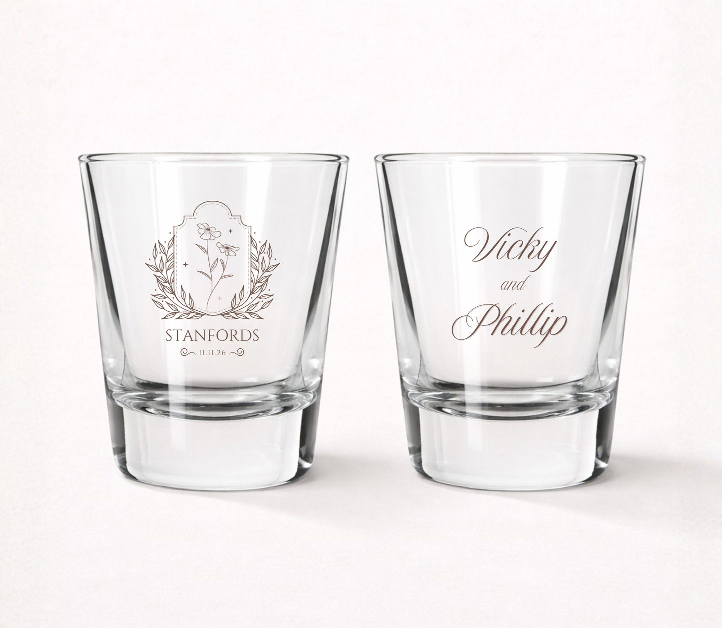 Personalized Stanfords Wildflower wedding shot glasses featuring custom couple names, family name, wedding date, and elegant botanical floral crest.