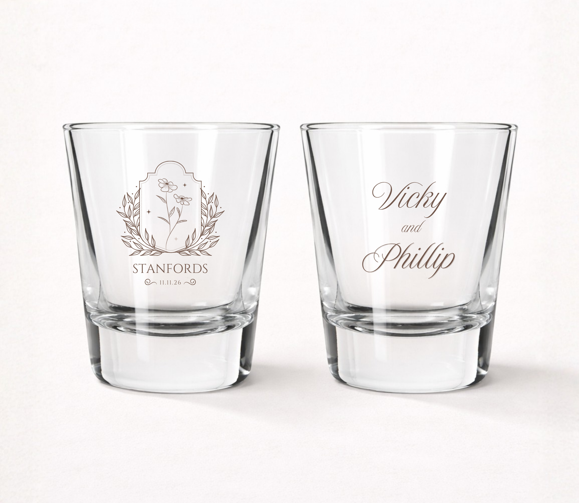 Personalized Stanfords Wildflower wedding shot glasses featuring custom couple names, family name, wedding date, and elegant botanical floral crest.