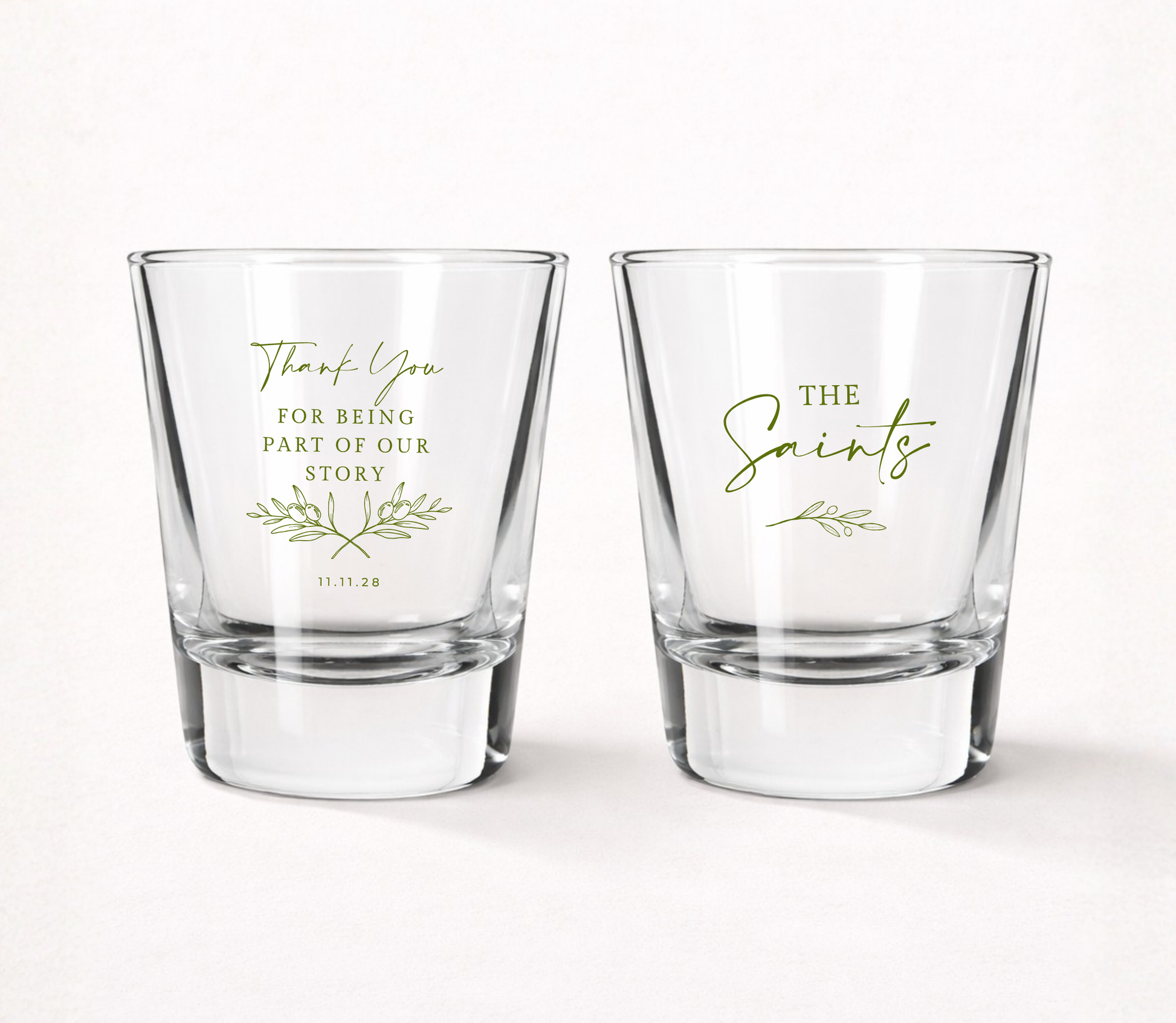 Personalized Thank You wedding shot glasses featuring a custom family name, wedding date, botanical olive branch artwork, and Thank You For Being Part Of Our Story message.