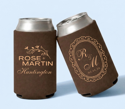 Brown personalized foam wedding can coolers featuring botanical artwork, custom names Rose and Martin Huntington, vintage monogram R&M, and wedding date February 14, 2028.