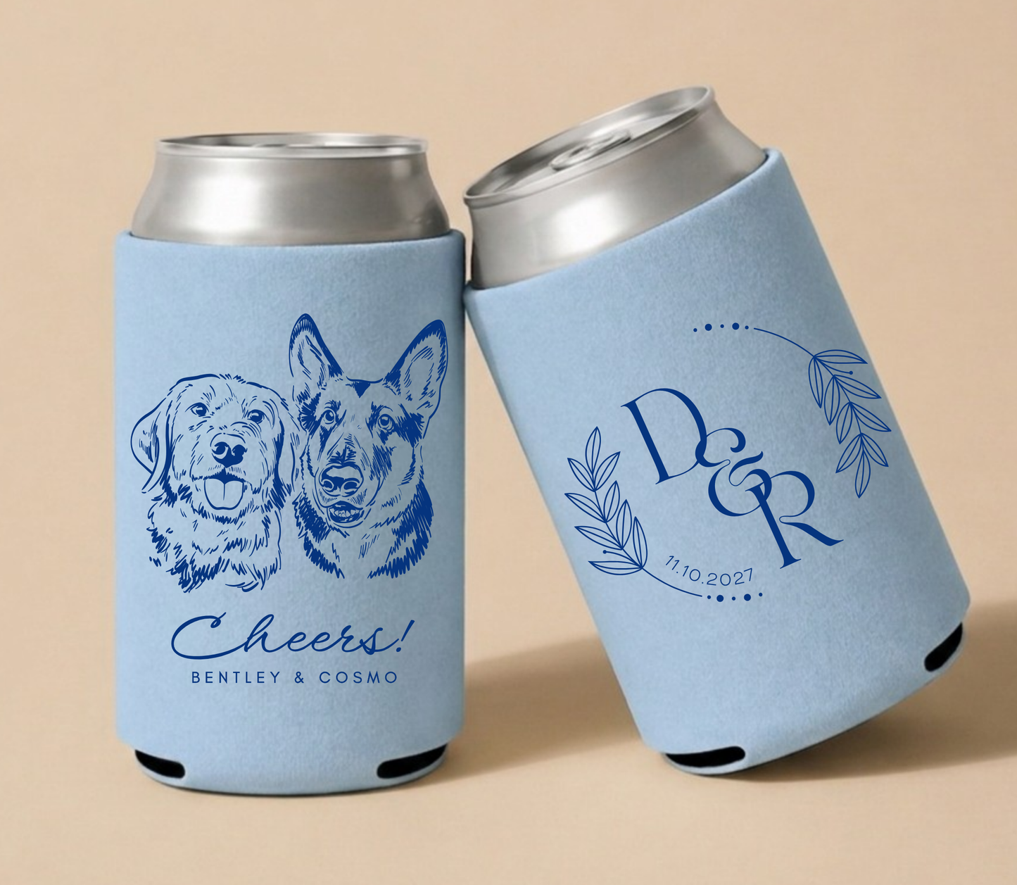Dusty blue personalized wedding can coolers featuring two custom dog portraits, elegant monogram, couple names, and wedding date.