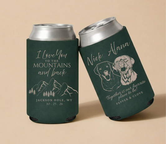 Forest green personalized wedding can coolers featuring scenic mountain artwork, custom dog portraits, couple names, wedding location, and wedding date.