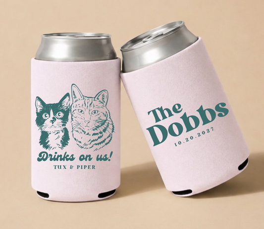 Blush personalized wedding can coolers featuring custom cat portraits, playful wedding wording, and wedding date.