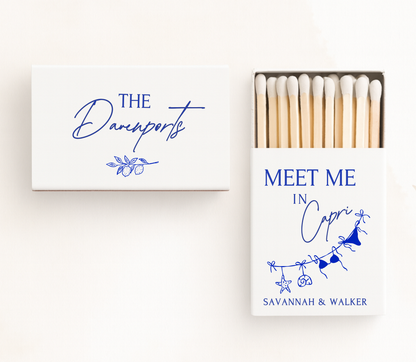 Personalized Capri wedding matchboxes featuring elegant blue typography, Mediterranean-inspired illustrations, and custom wedding names.