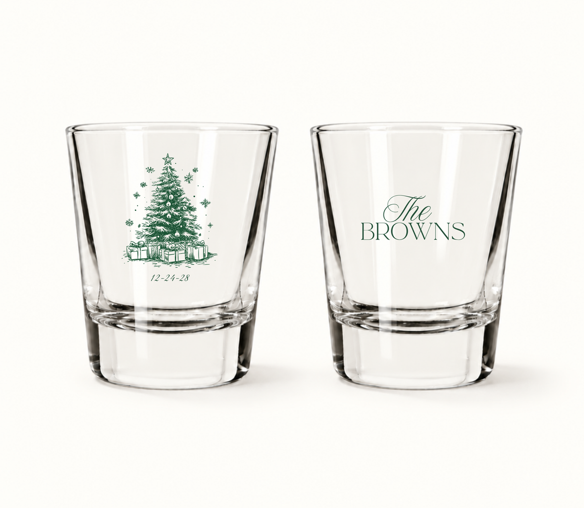 Personalized Christmas wedding shot glasses featuring a detailed Christmas tree illustration, wedding date, and custom family name.