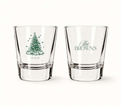 Personalized Christmas wedding shot glasses featuring a detailed Christmas tree illustration, wedding date, and custom family name.