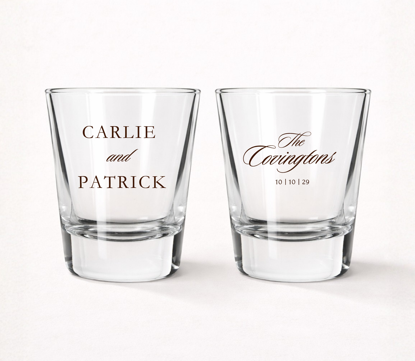 Clear personalized classic wedding shot glasses featuring elegant couple names, family surname, and wedding date.