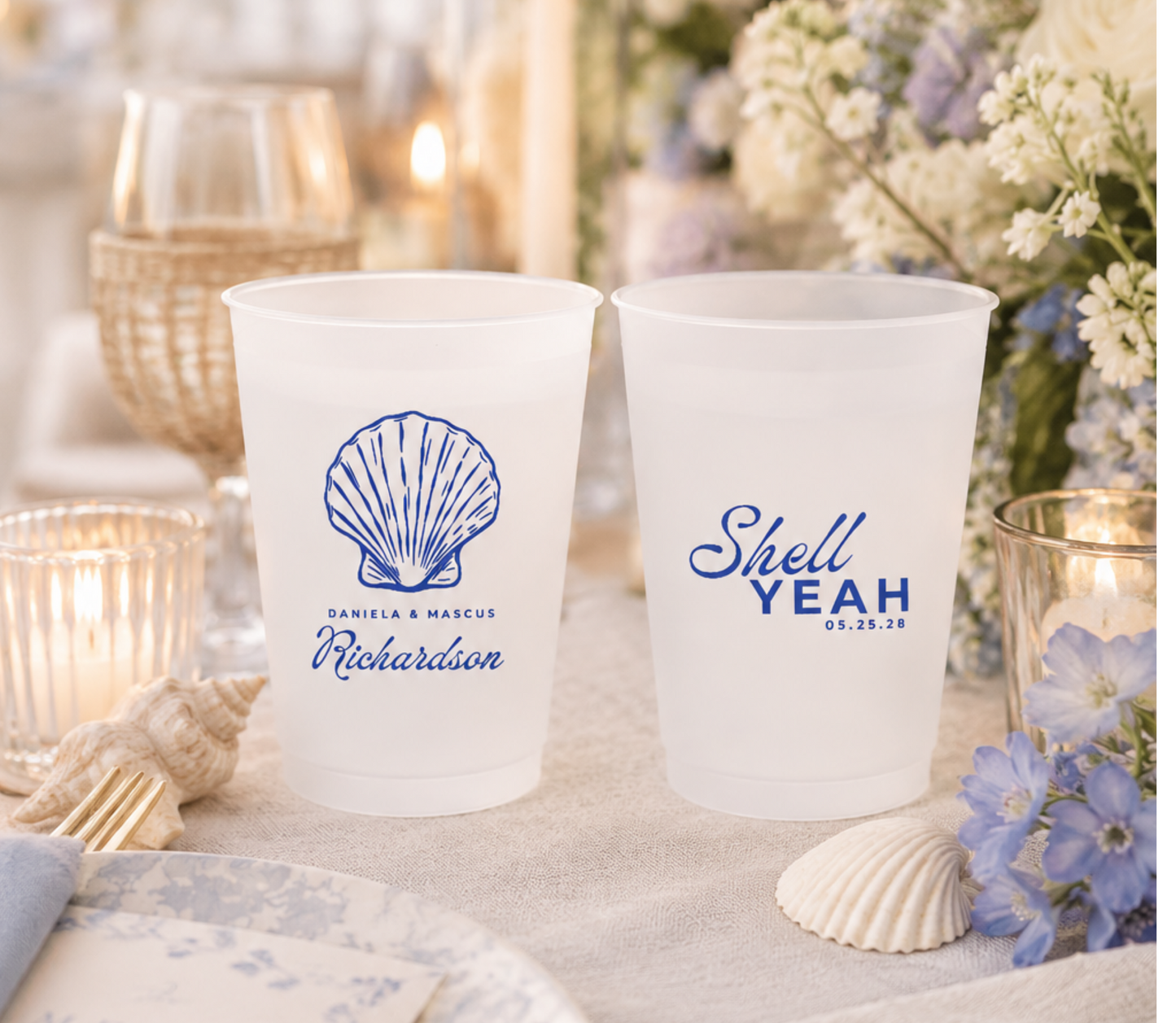 Custom coastal wedding frosted cups with blue seashell artwork, personalized names, wedding date, and beach inspired wording