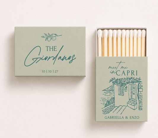 Sage green personalized Italian destination wedding matchboxes featuring Capri-inspired coastal artwork, elegant blue typography, custom couple names, wedding date, and premium safety matches.
Personalized Italian destination wedding matchbox featuring Capri-inspired coastal artwork and elegant typography.
Custom Capri wedding matchbox with Mediterranean illustration, couple names, and wedding date.