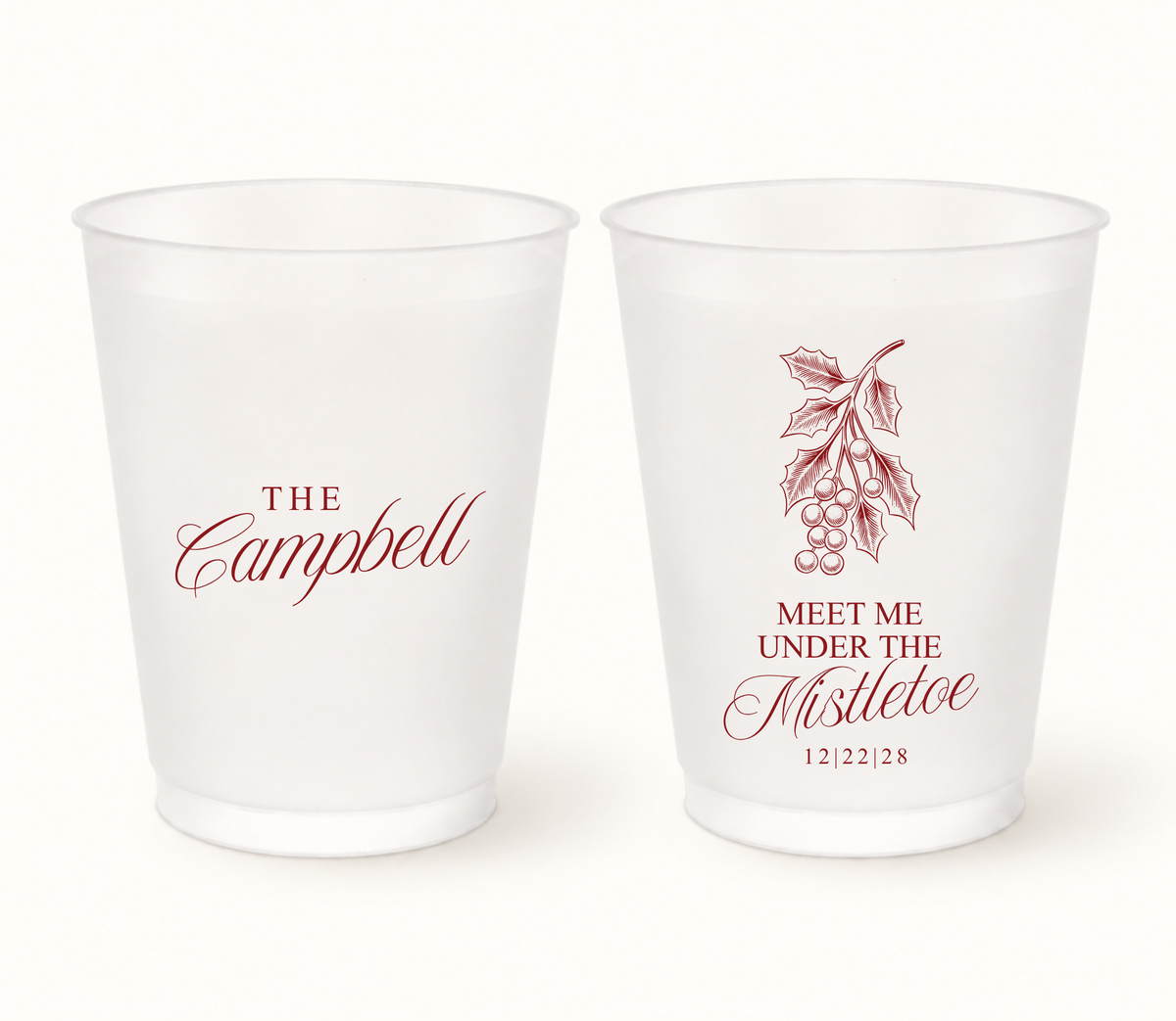 Personalized Mistletoe wedding frosted cups featuring Christmas greenery design with custom couple names and wedding date.