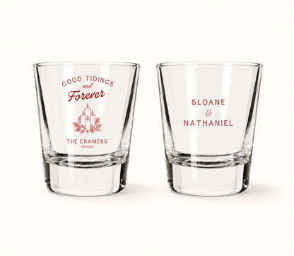 Personalized Good Tidings and Forever Christmas wedding shot glasses featuring candle artwork, custom couple names, and wedding date.