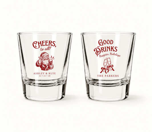 Personalized Christmas wedding shot glasses featuring Santa and holiday drink designs with custom couple names and wedding date.