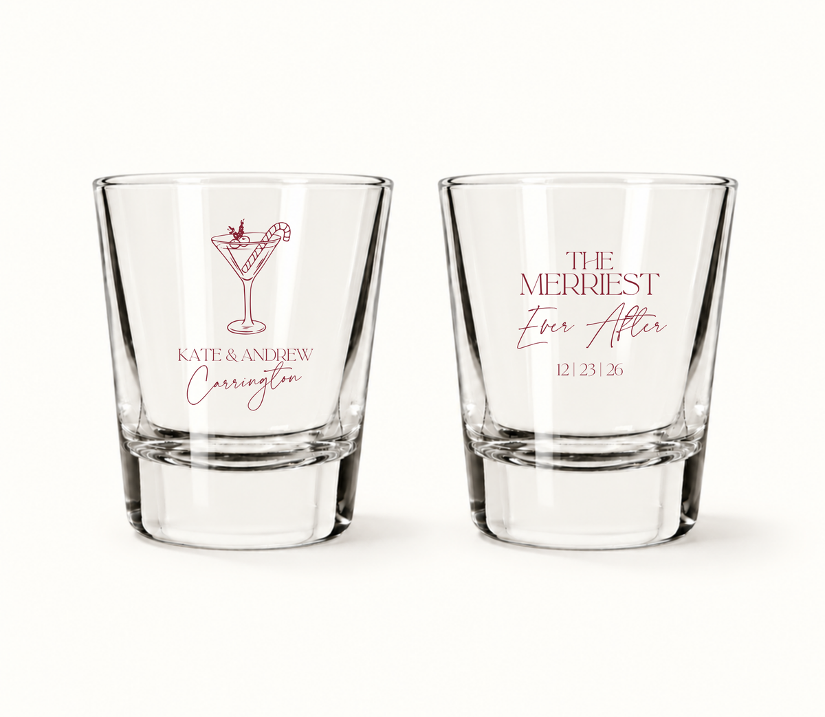 Personalized Merriest Ever After Christmas wedding shot glasses featuring festive cocktail artwork, custom couple names, and wedding date.