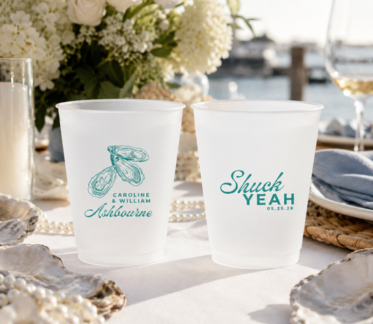 Custom oyster wedding frosted cups with oyster artwork, personalized names, coastal design, and beach inspired wedding details