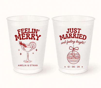 Personalized Feelin' Merry Christmas wedding frosted cups featuring festive cocktail and ornament designs with custom couple names and wedding date.