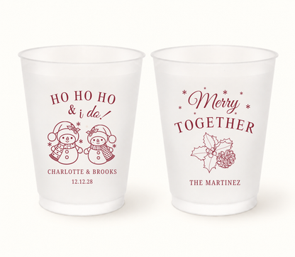 Personalized Merry Together Christmas wedding frosted cups featuring snowman and holly holiday designs with custom couple names and wedding date.