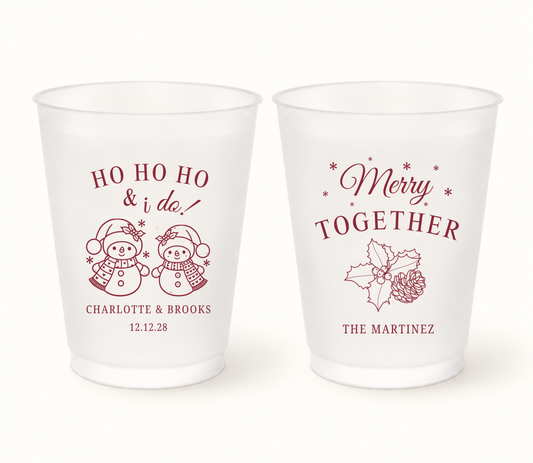 Personalized Merry Together Christmas wedding frosted cups featuring snowman and holly holiday designs with custom couple names and wedding date.