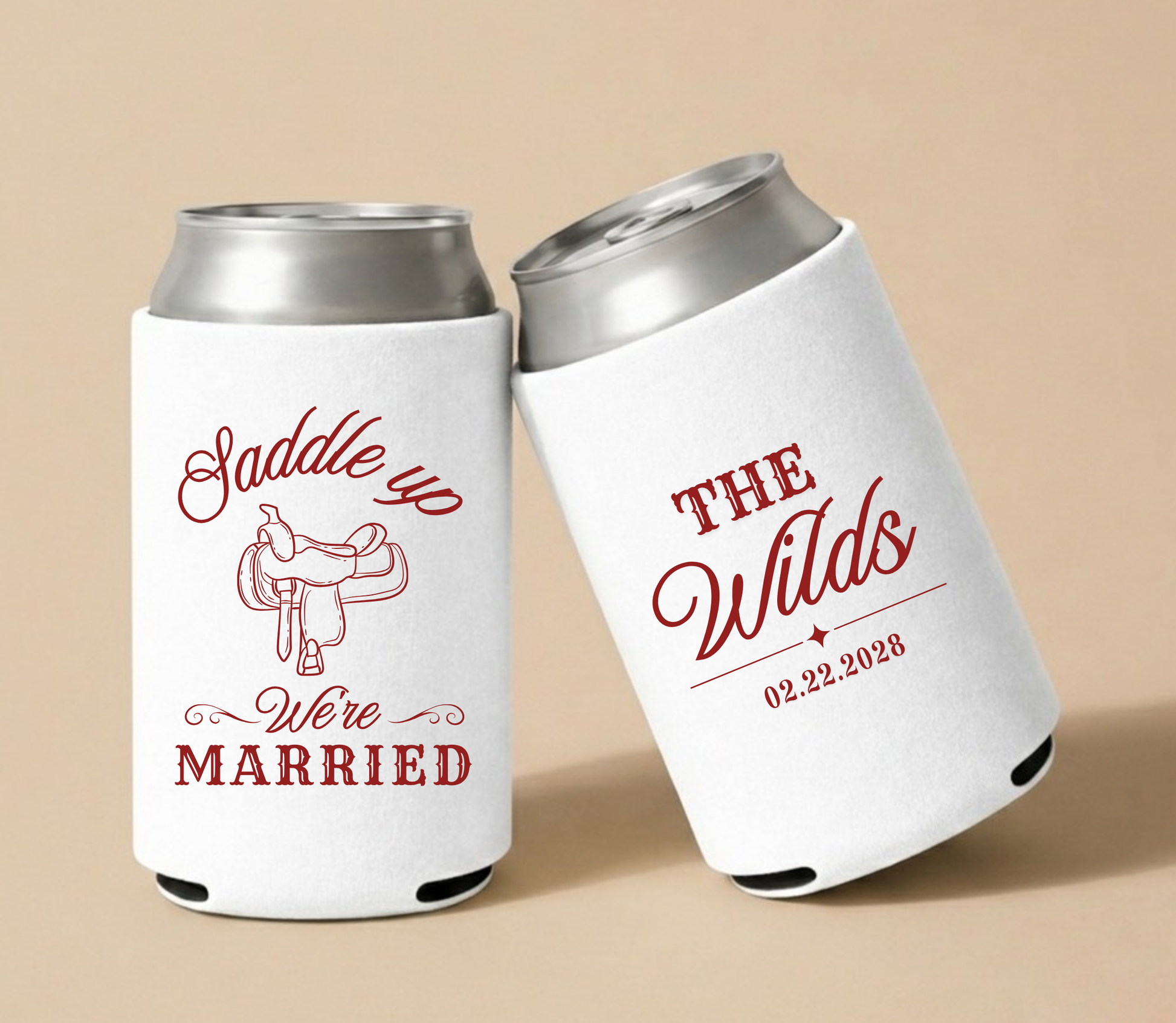 Custom Saddle Up western wedding can coolers with red saddle artwork, personalized couple name, and wedding date on white drink sleeves  