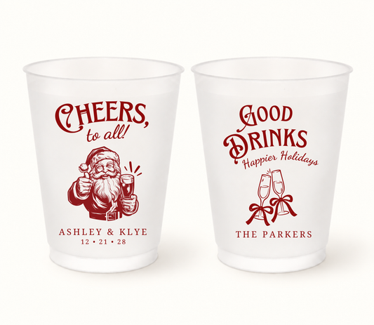Personalized Cheers Santa Christmas wedding frosted cups featuring Santa and holiday drink designs with custom couple names and wedding date.