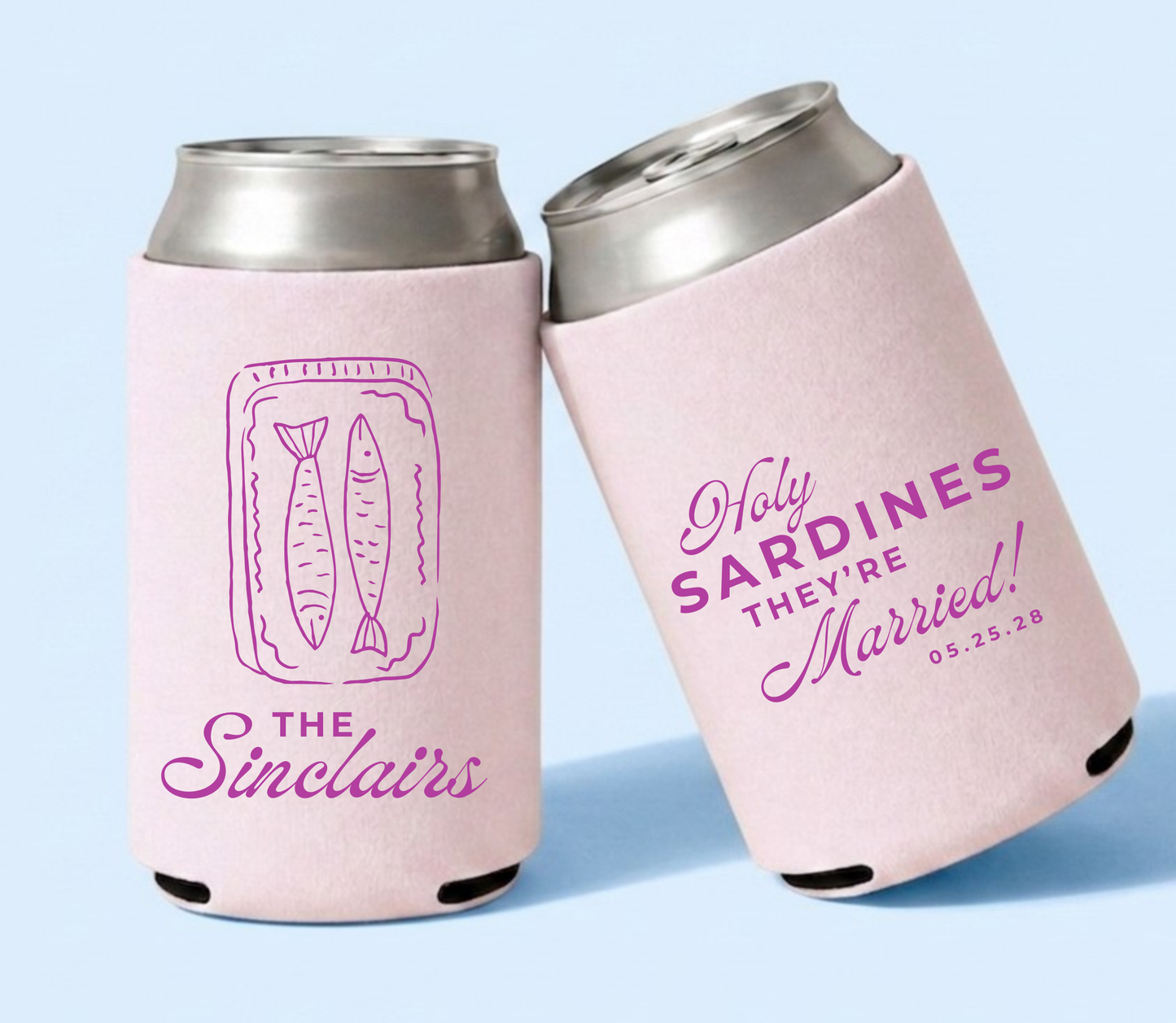 Two pink can coolers with 'Holy Sardines They're Married!' text on a light blue background