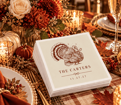 Thanksgiving wedding table setting featuring personalized napkins with vintage turkey artwork and elegant brown typography.
