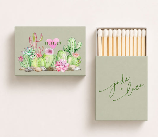 Personalized wedding matchboxes featuring watercolor cactus and succulent artwork, custom names Jade and Luca, and wedding date on a sage green matchbox design.