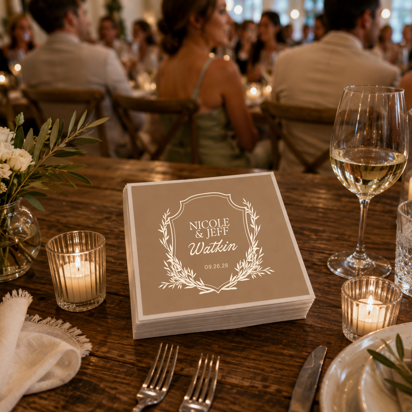 
Taupe botanical crest wedding napkin featuring personalized couple names and family surname.
