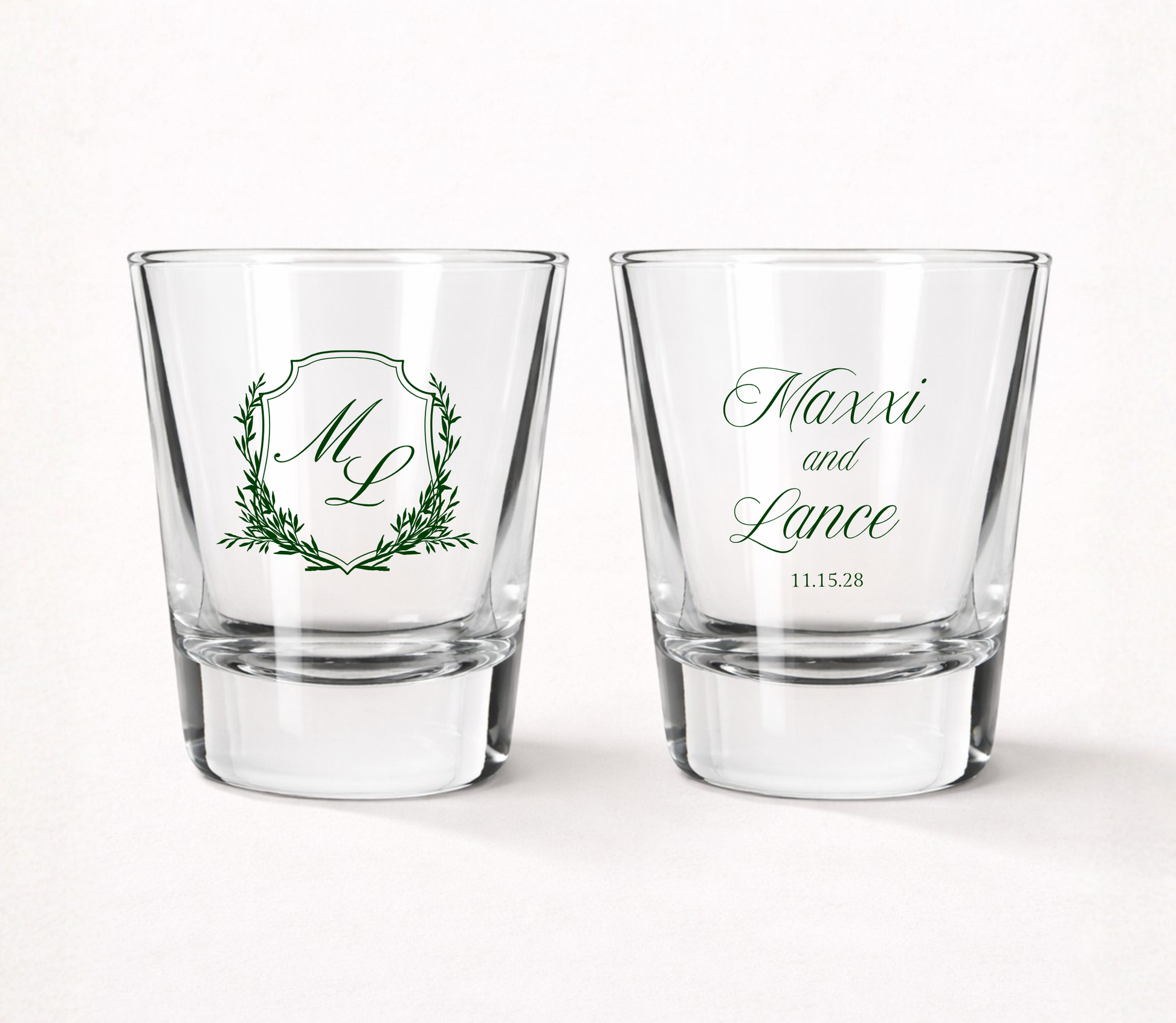 Personalized Maxxi Laurel Monogram wedding shot glasses featuring custom initials, couple names, wedding date, and elegant laurel frame.