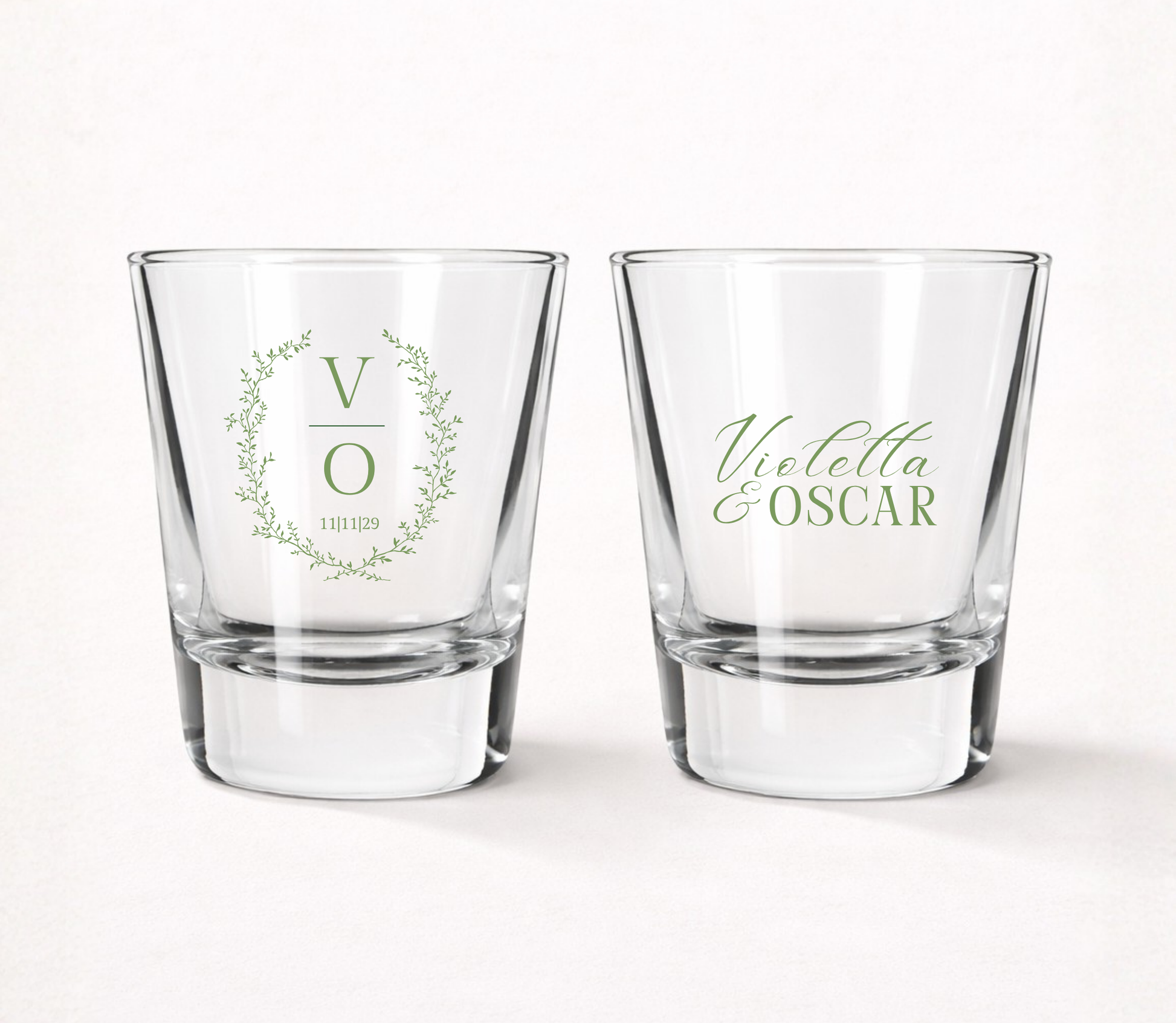 Personalized Botanical Monogram wedding shot glasses featuring a custom initial, delicate greenery wreath, couple 