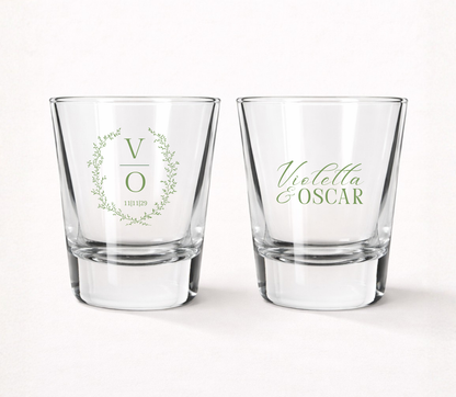 Personalized Botanical Monogram wedding shot glasses featuring a custom initial, delicate greenery wreath, couple 