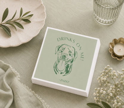 Custom paper wedding napkin featuring a dog portrait, personalized pet name, and Drinks on Me message.