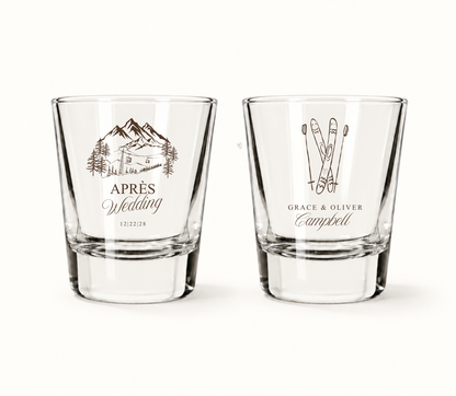 Personalized Après Wedding ski shot glasses featuring mountain resort artwork, crossed skis, custom couple names, and wedding date.