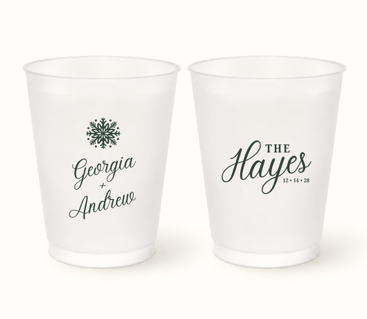 Personalized snowflake Christmas wedding frosted cups featuring elegant winter design, custom couple names, family surname, and wedding date.