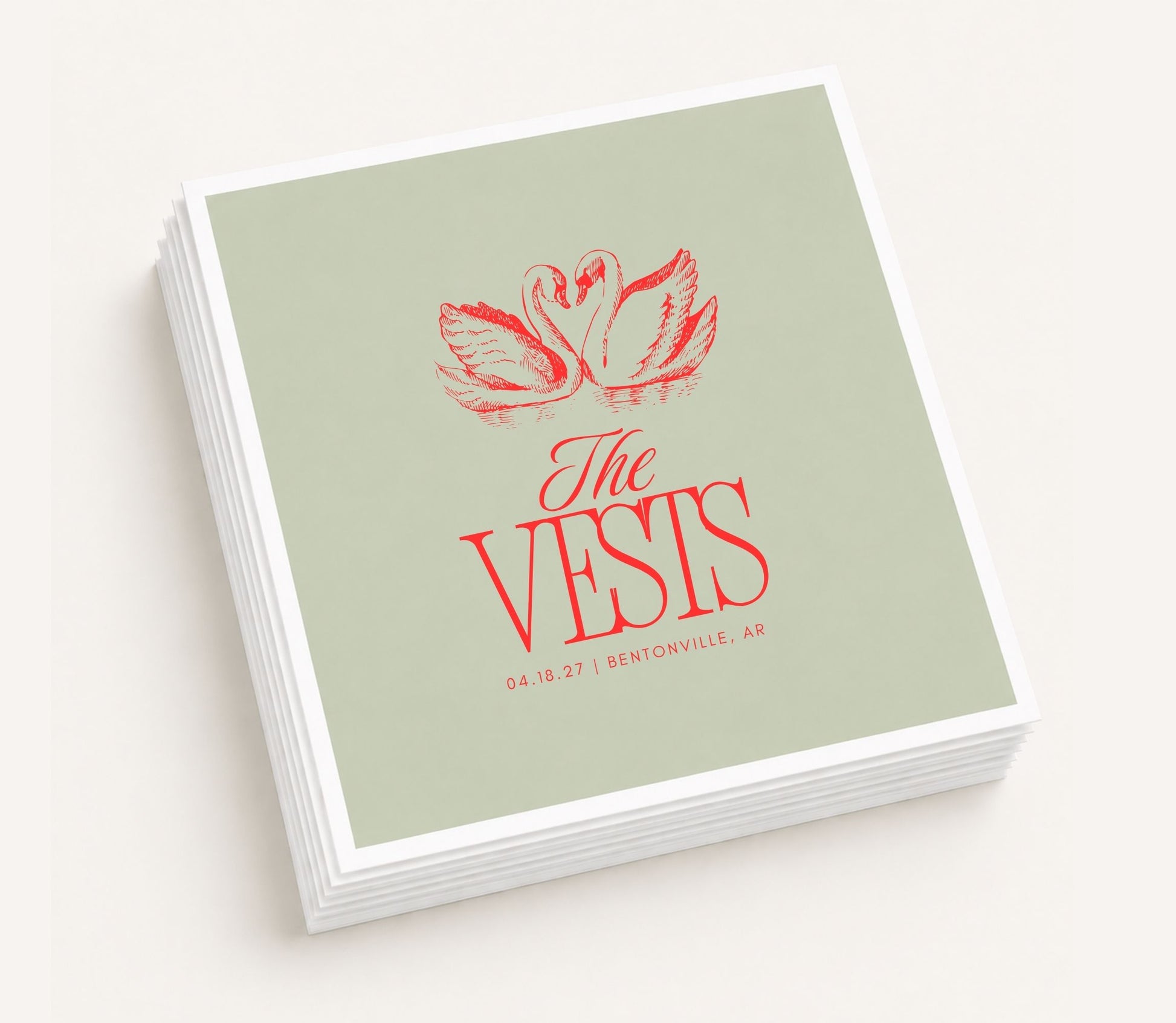 Personalized wedding cocktail napkins featuring romantic swan artwork, custom family name Vests, wedding date, and venue location.
Custom swan wedding napkin featuring personalized wedding details.