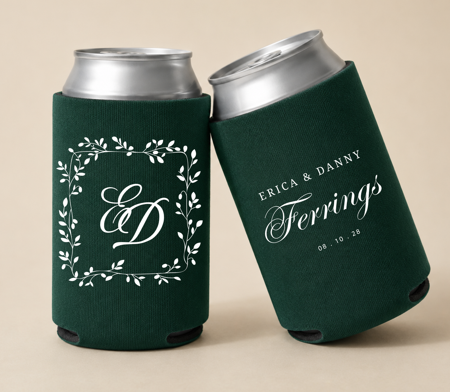 Dark green personalized wedding can coolers featuring a botanical monogram frame with custom initials, the family name Ferrings, couple names Erica and Danny, and wedding date.
