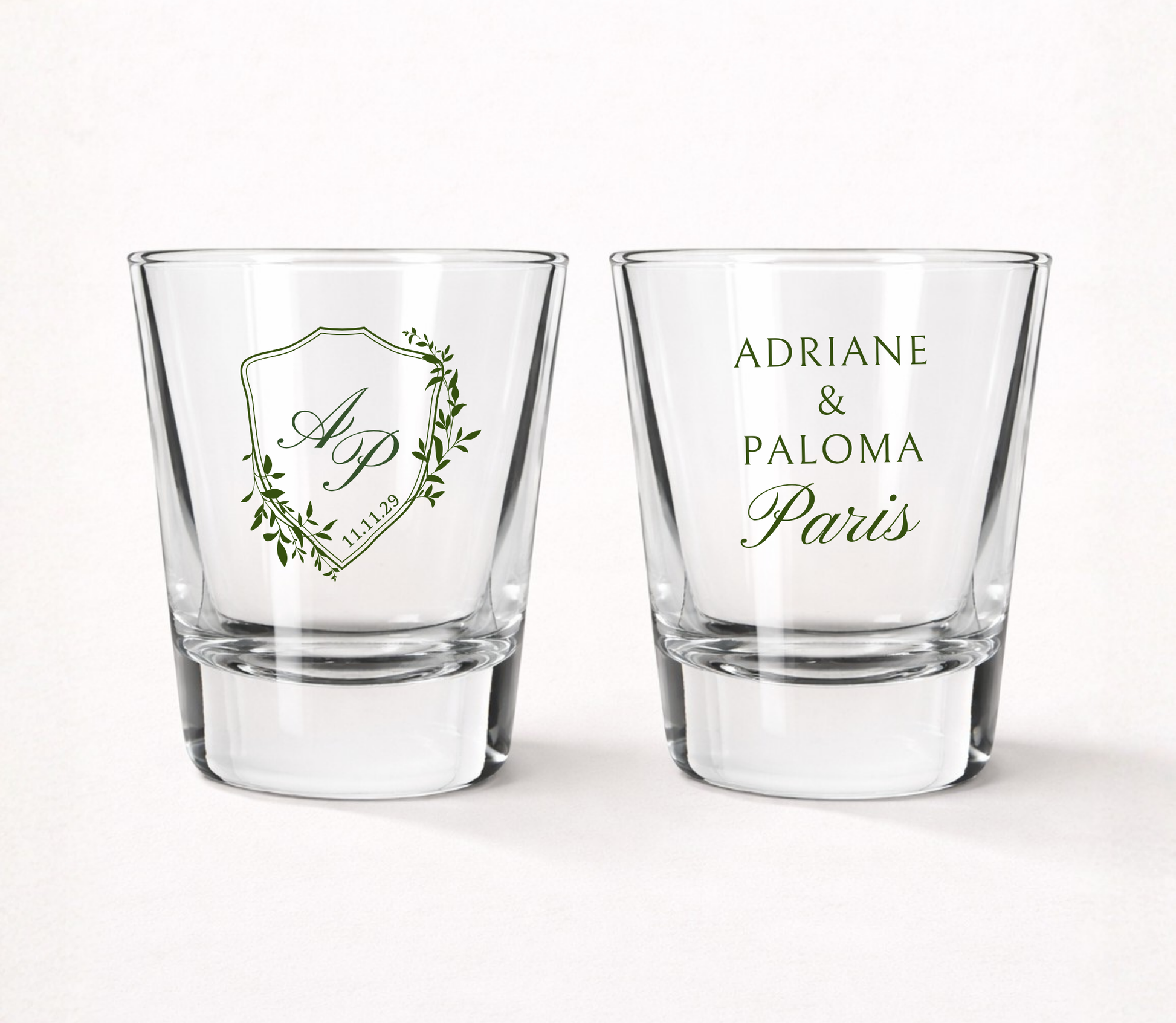 Personalized Paris Crest wedding shot glasses featuring custom initials, couple names, wedding date, and an elegant botanical crest design.