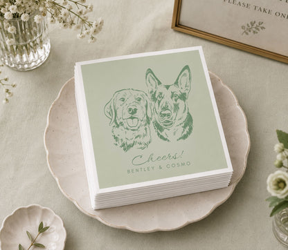 Custom wedding table napkin featuring two dog portraits, personalized names, and elegant reception décor.