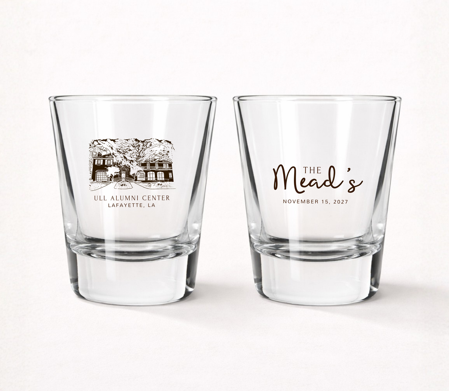 Clear personalized wedding shot glasses featuring a custom venue illustration, family name, and wedding date for a memorable wedding keepsake.