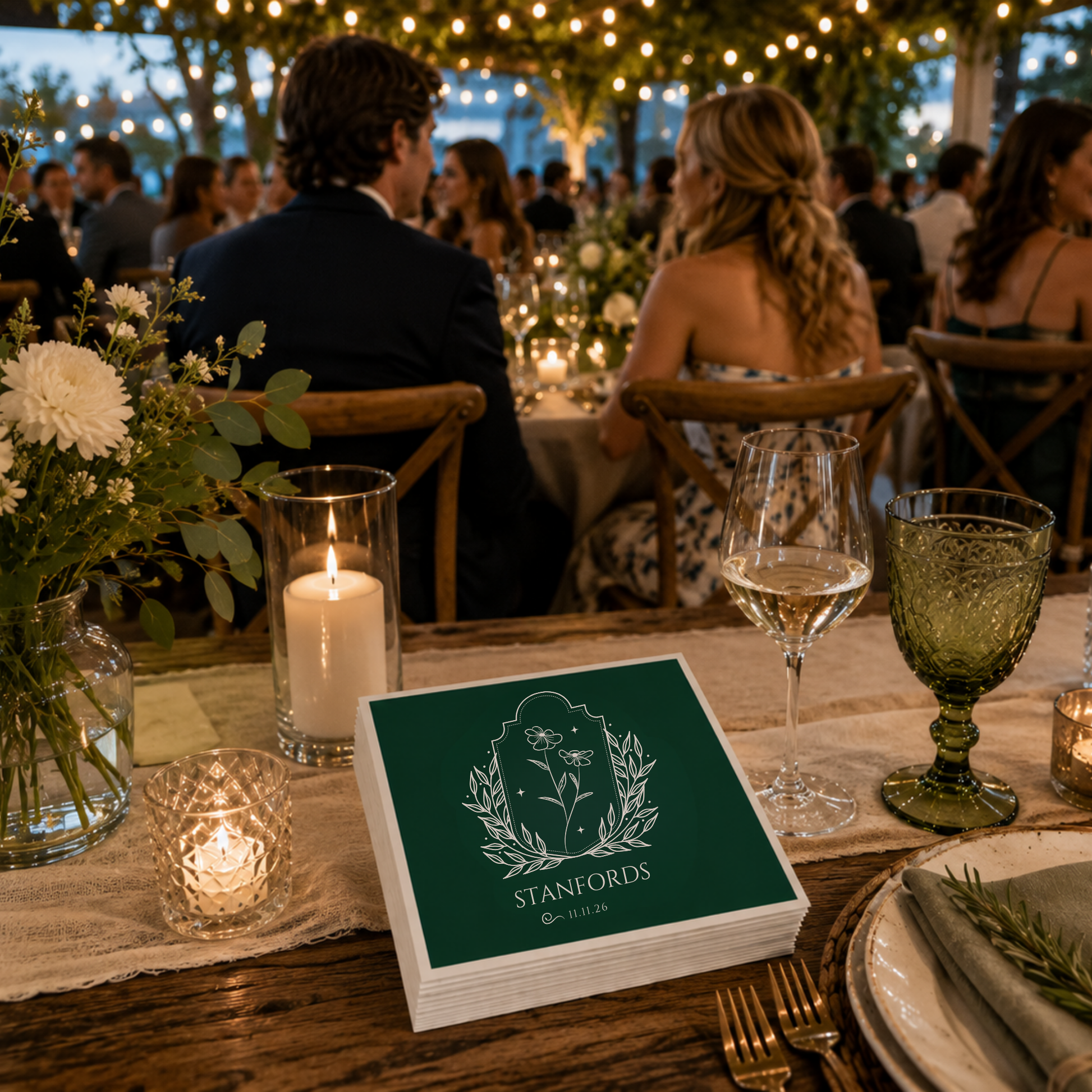 
Dark green botanical wedding napkin with floral illustration and personalized surname.
