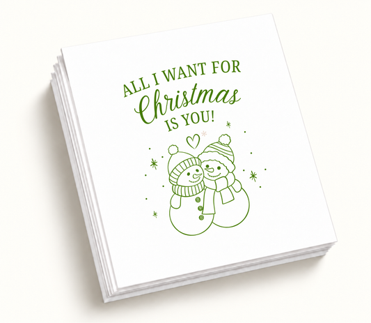 Personalized All I Want For Christmas Is You Christmas wedding napkins featuring white background, green snowman couple artwork, custom names, and wedding details.